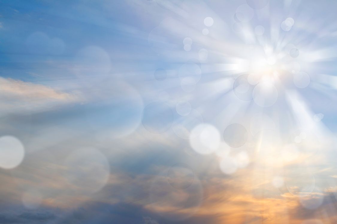 Sun in the sky, orange, blue, clouds, bright sunshine and vitamin D